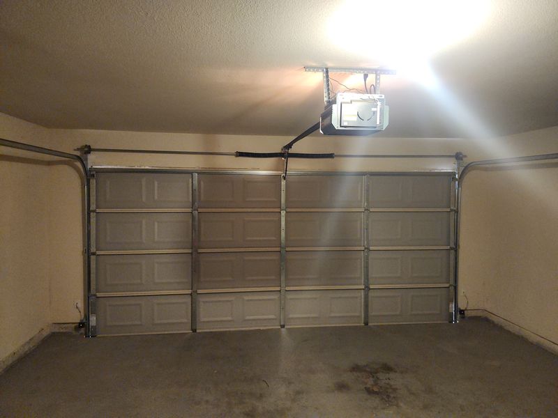 New raised-panel double garage door installed in Aubrey, TX