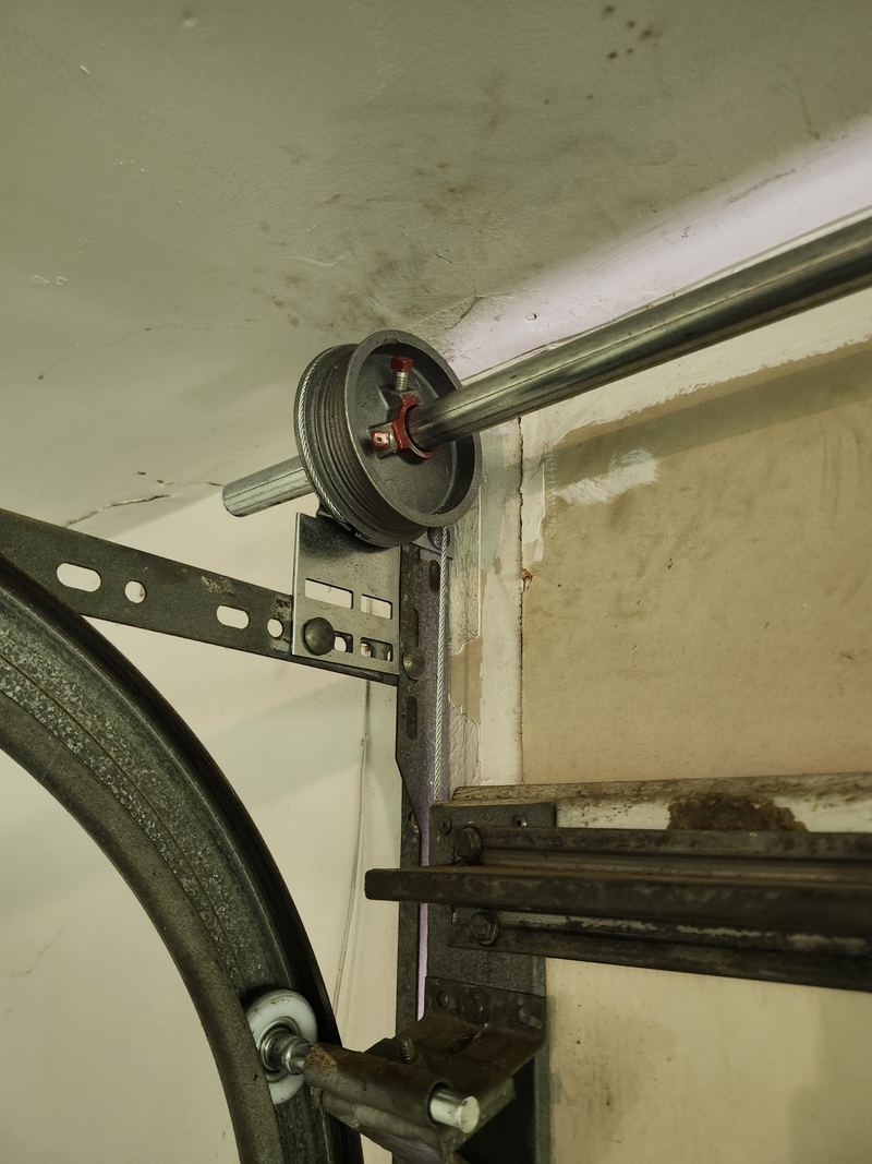 Cable drum and track on a spring repair in Addison, TX