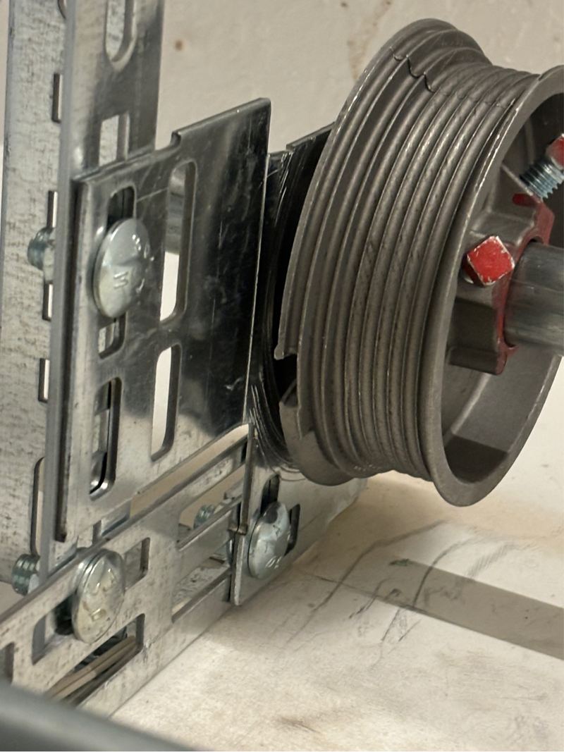 Cable drum on an off-track door repair in Forney, TX