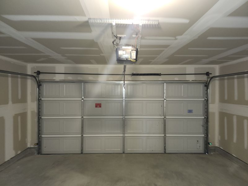 Double garage door with a new opener in Crandall, TX