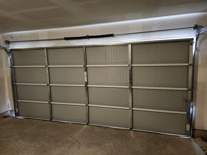Inside view of a new raised-panel double garage door in Crandall, TX