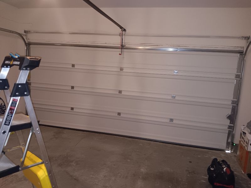 Garage door during a repair in Cross Roads, TX