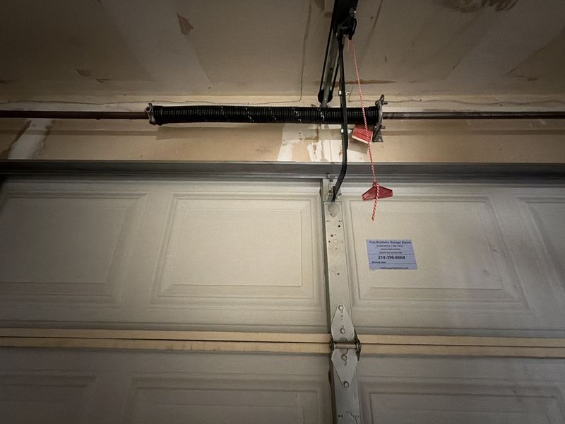 Spring and cables checked on a door balance in Lancaster, TX