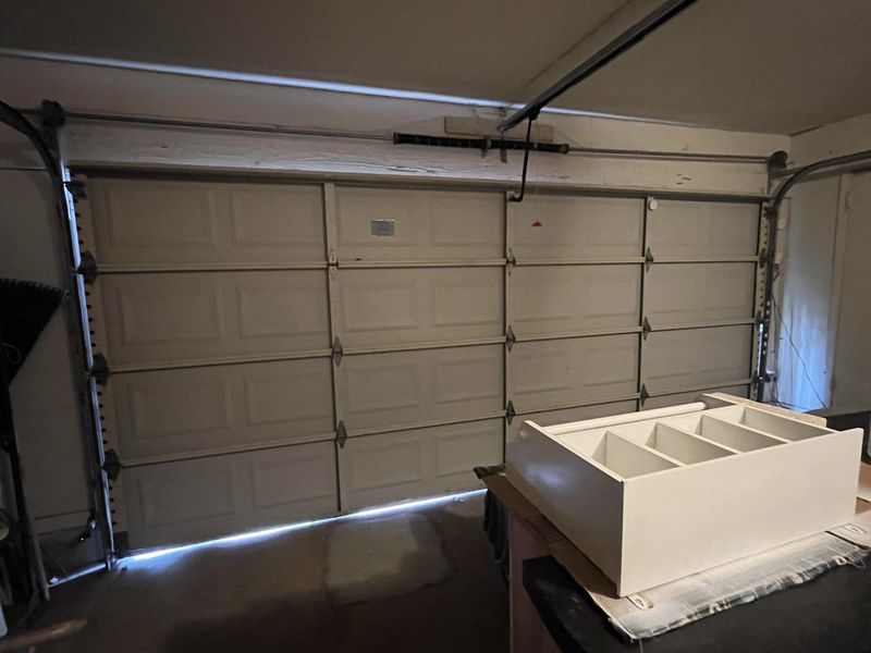 Double garage door running after a spring replacement in Ennis, TX