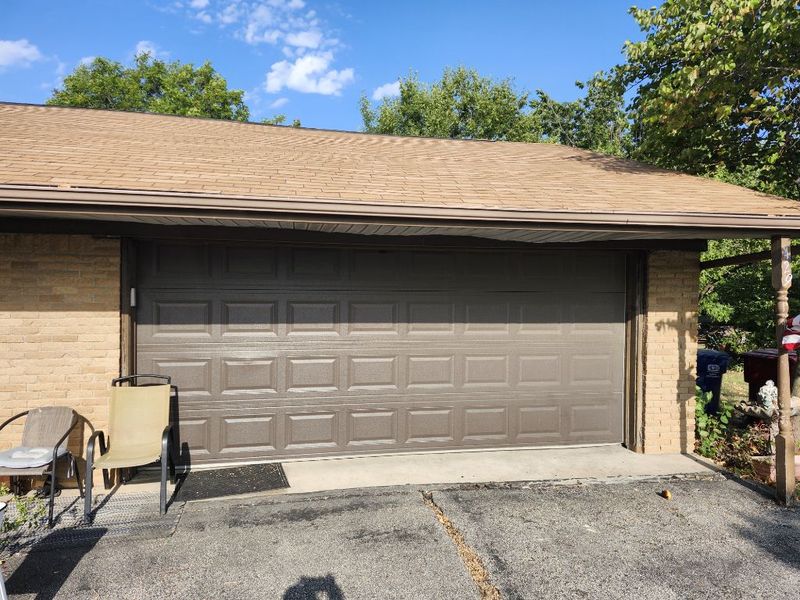 Brown double garage door back on track in Farmersville, TX
