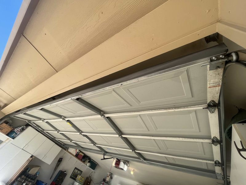 Inside view of a double garage door after a balance adjustment in Fate, TX