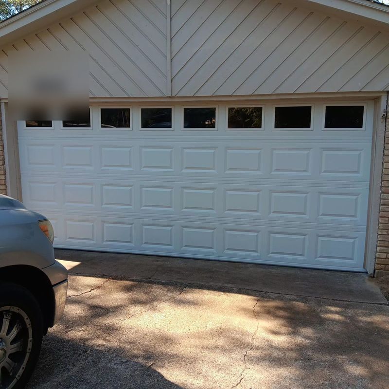 New white double garage door with a row of windows installed in Fort Worth, TX