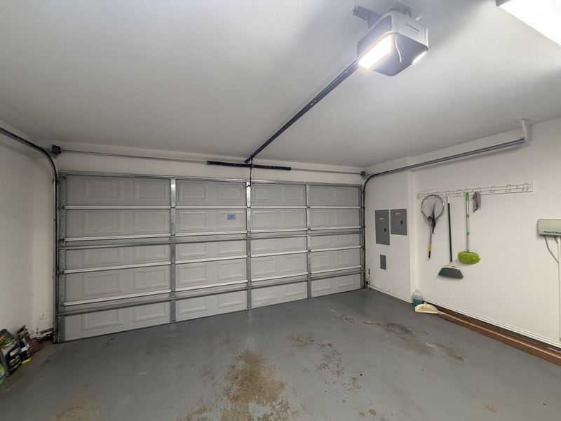 Garage door and opener after a repair in Dallas, TX