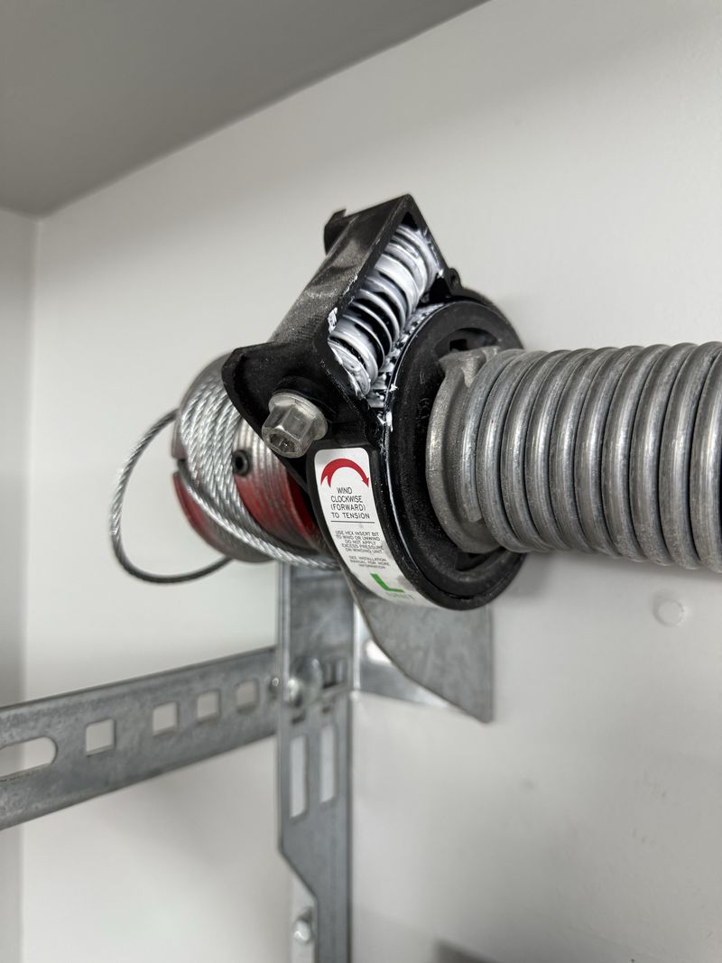 New torsion spring and cable drum on a garage door in Hurst, TX