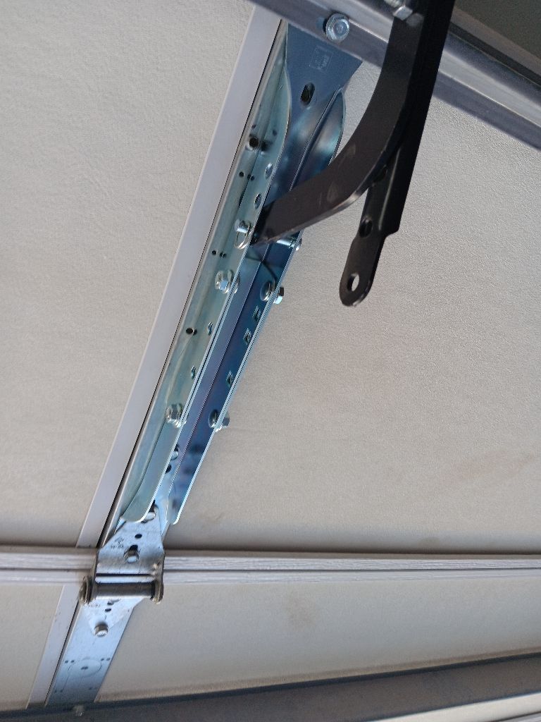 Track and opener rail after a safety tune-up in Joshua, TX