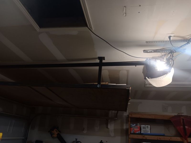 Garage door opener and door after a repair in Justin, TX