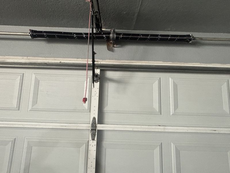 Torsion spring and opener rail after a garage door repair in Kaufman, TX