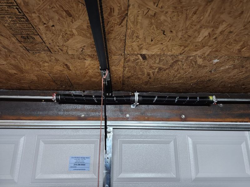 New torsion spring and opener rail on a new garage door in Kaufman, TX