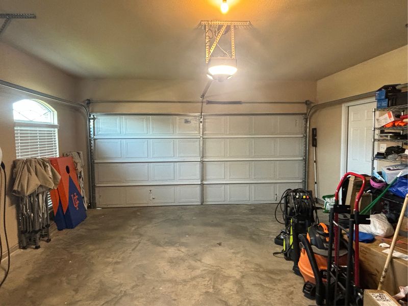 Double garage door running smoothly after service in Kennedale, TX