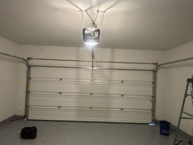 Double garage door running after a repair in Krugerville, TX