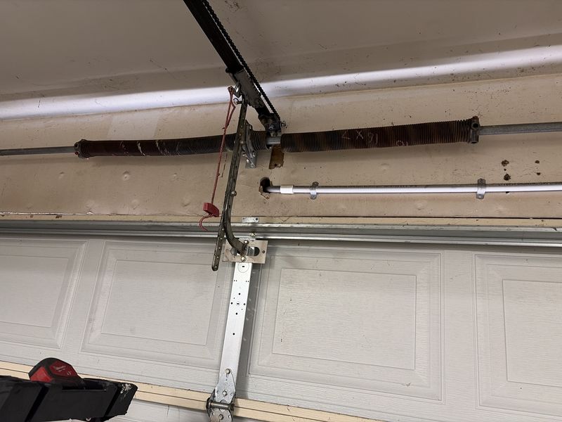 New torsion spring above a garage door in the Lake Highlands area of Dallas, TX