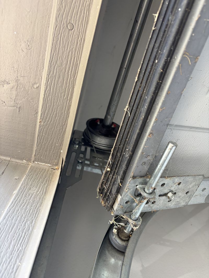 Cable drum and track checked during a spring replacement in Lakewood Village, TX