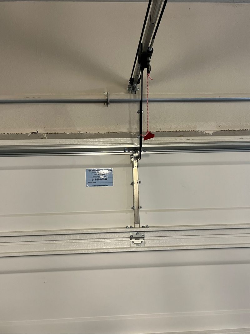 New garage door opener rail and door hardware in Lantana, TX