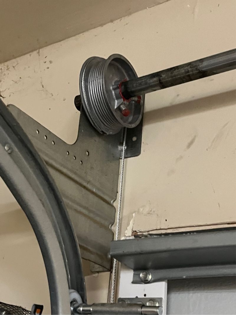 Cable drum and track checked on a garage door in Lavon, TX