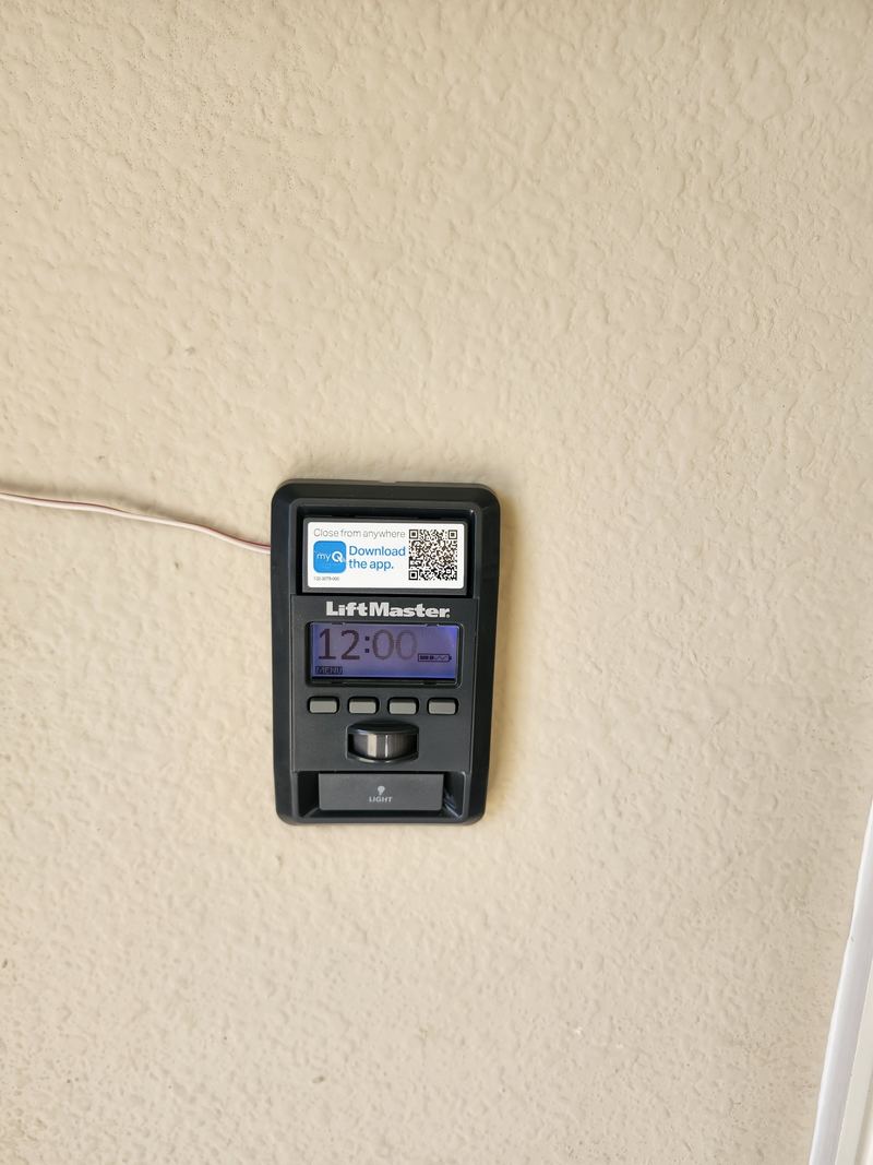 LiftMaster smart wall control installed with a new garage door in North Richland Hills, TX