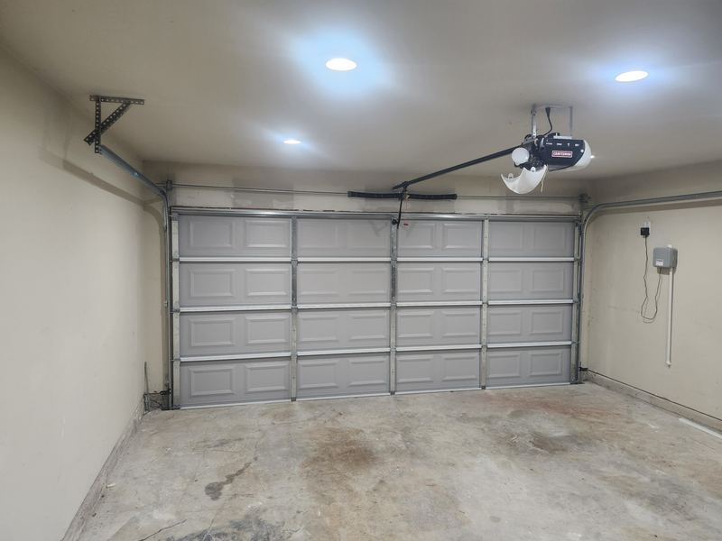 New garage door with tracks, springs and opener installed in Princeton, TX