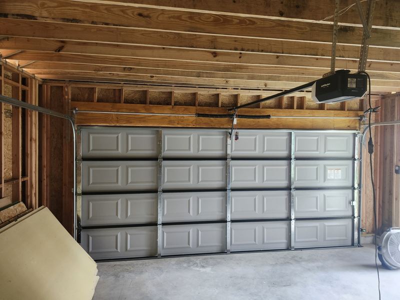 New garage door and LiftMaster opener installed in a new garage build in Dallas, TX (after)