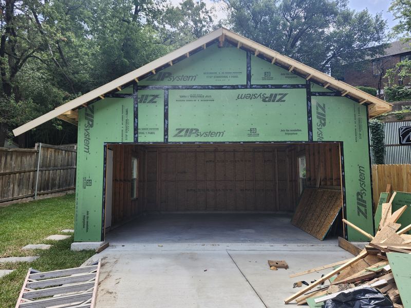 New garage build framed and ready for a garage door in Dallas, TX (before)