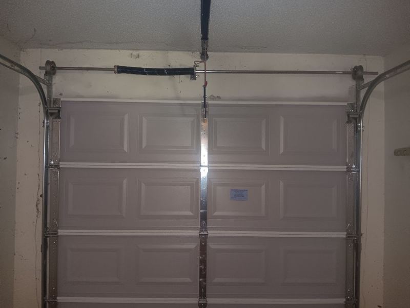 New single-car door and torsion spring, inside view in Azle, TX