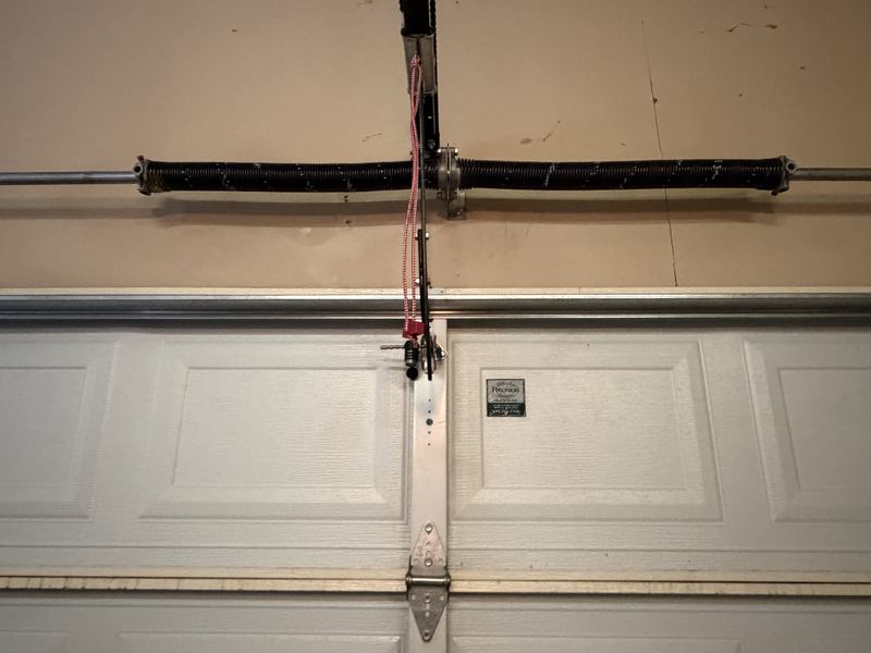 New torsion springs installed on a garage door in Carrollton, TX