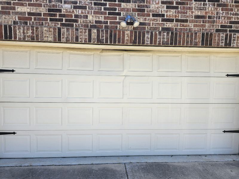 New white double door with black carriage hardware in Wylie, TX