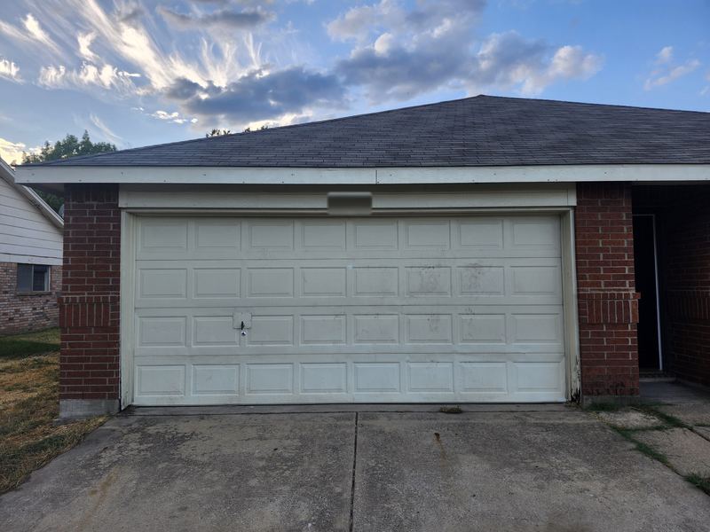 The same garage door back on track and closed after repair in Terrell, TX (after)