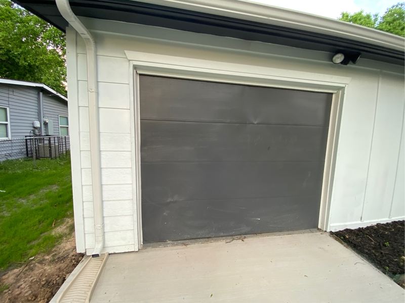 Opener install on a gray single-car door in Mesquite, TX