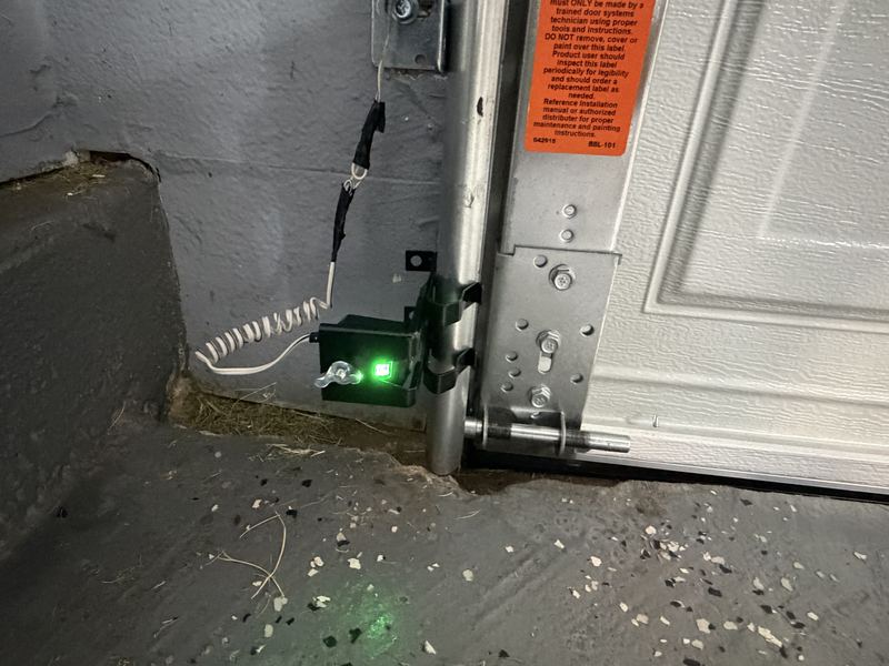 Safety sensor lined up after an opener install in Lewisville, TX