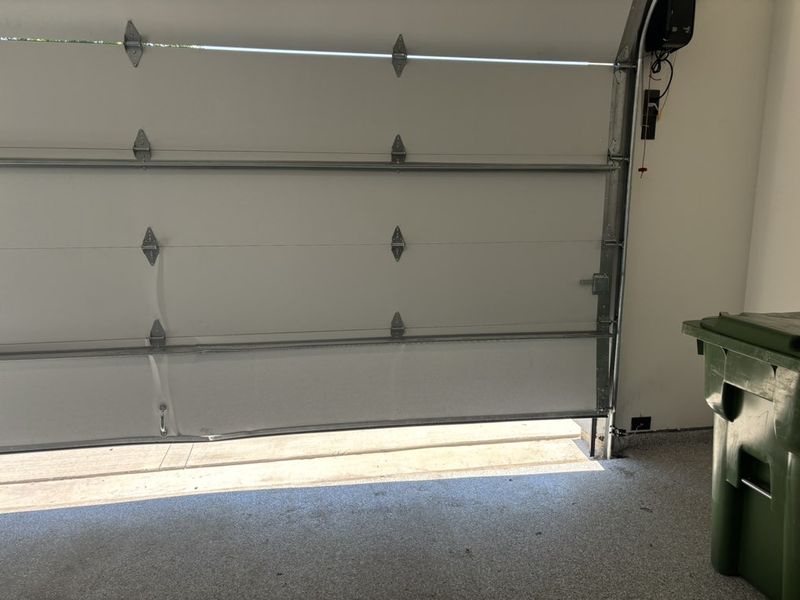Door bottom and track checked on a repair in Parker, TX