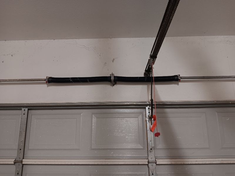 New torsion spring installed on a garage door in Providence Village, TX