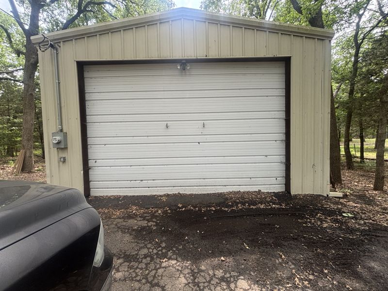 Detached garage door back on track in Quinlan, TX