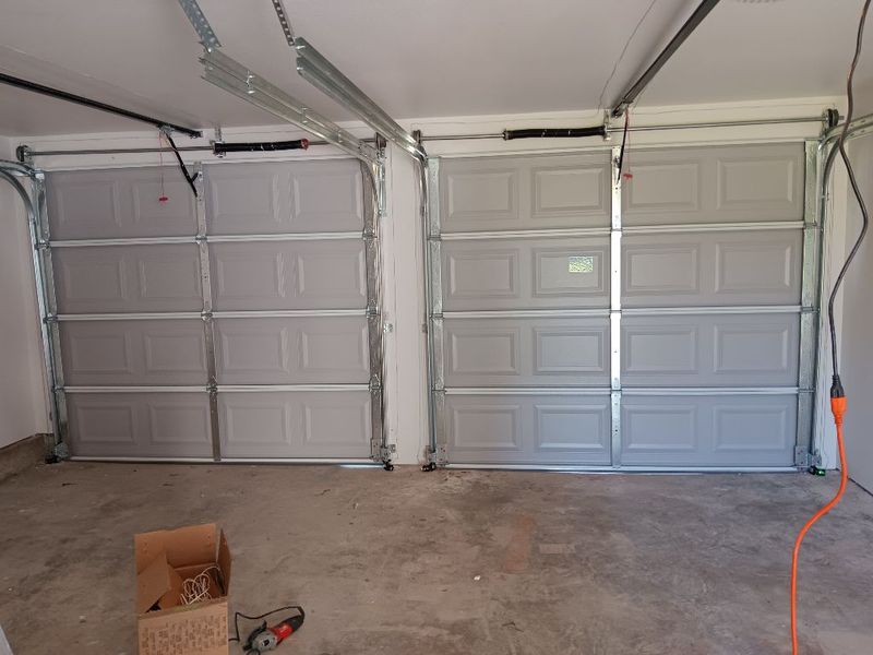New single door installed, two-bay garage in Richland Hills, TX