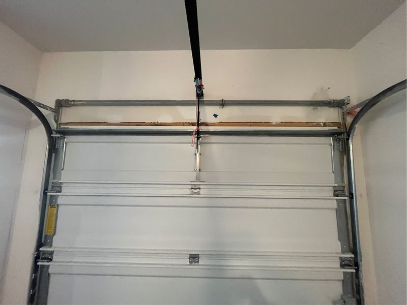 Single-car garage door after a panel replacement in Royse City, TX