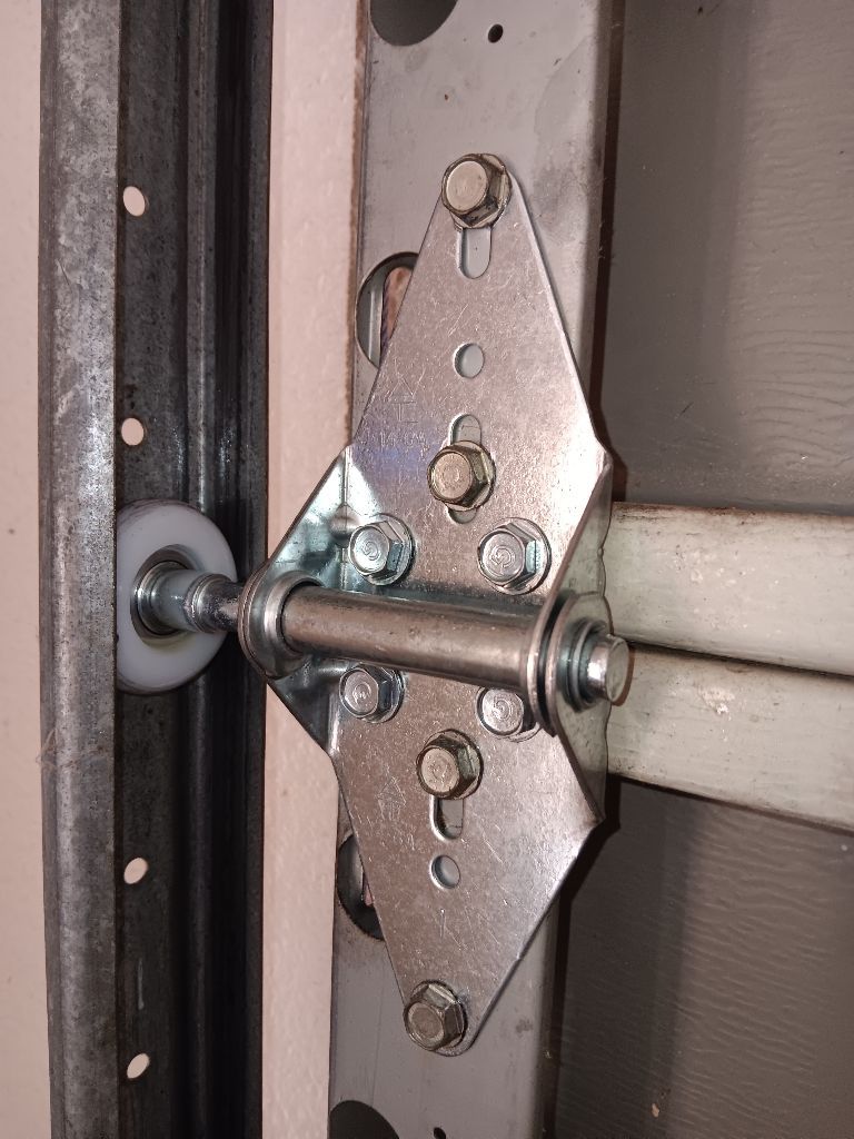 Roller and hinge after an off-track repair in Shady Shores, TX