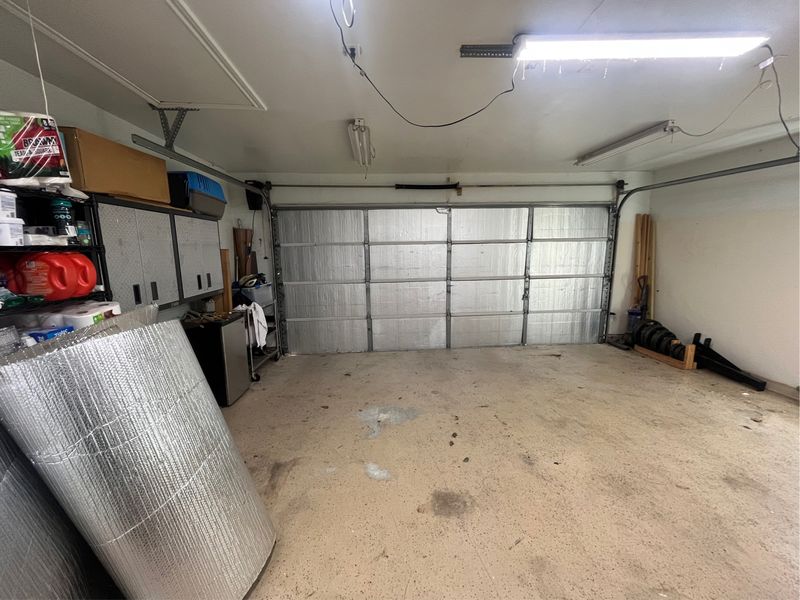Insulated garage door after an off-track repair in Shady Shores, TX
