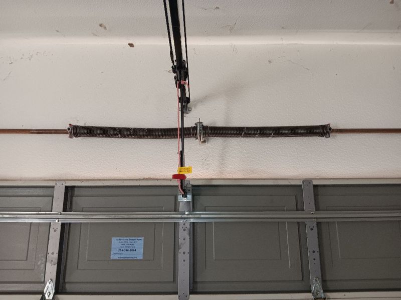 New torsion spring above a garage door in Shady Shores, TX