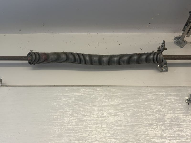 Torsion spring on a garage door repair in Arlington, TX