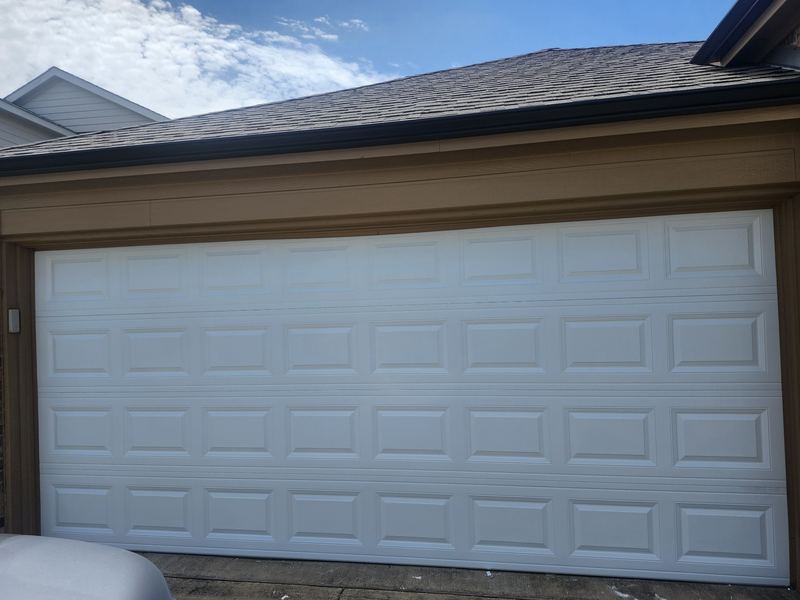 New white raised-panel garage door installed in Princeton, TX