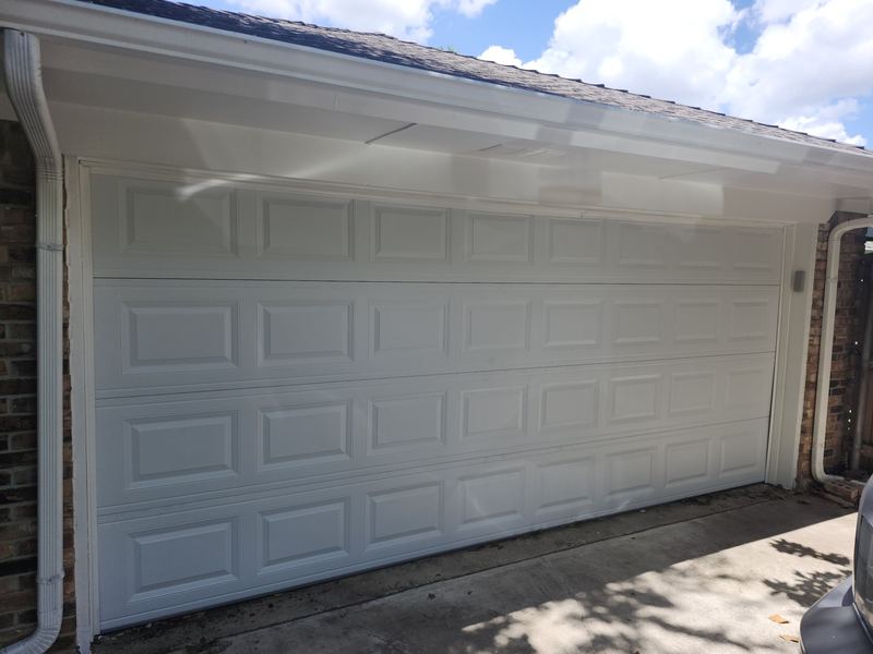 Replacement white raised-panel garage door installed in Plano, TX